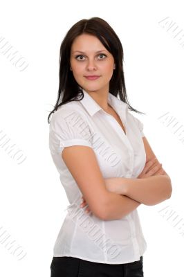 Young beautiful brunette girl in a white blouse