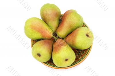 Ripe pears on the plate on a white background.