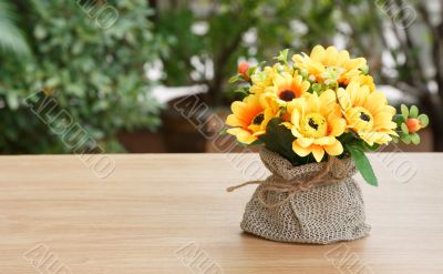 Decorative flower on wooden desk