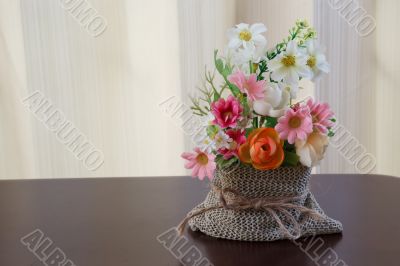 Decorative flower on wooden desk Decorative flower on wooden desk