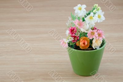 Decorative flower on wooden desk Decorative flower on wooden desk