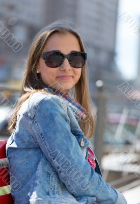 Young beautiful stylish girl smiling on a sunny day