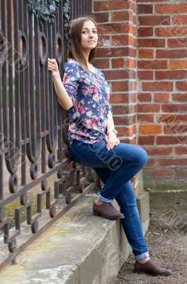 Full-length portrait of a pensive girl.