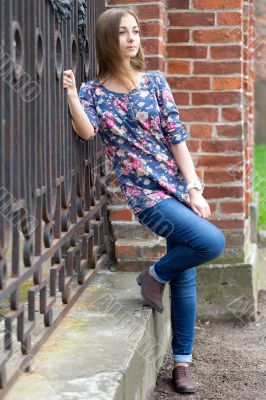 Full-length portrait of a pensive girl