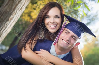 Male Graduate in Cap and Gown and Girl Celebrate