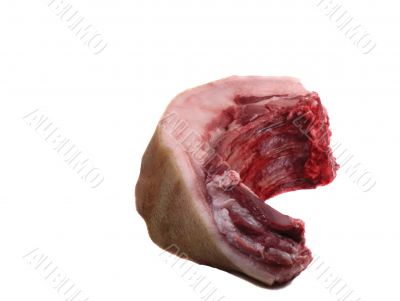 A large piece of raw pork meat on a white background.