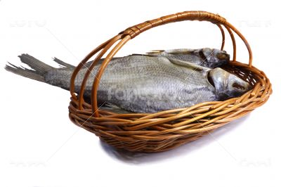 Salted and dried fish river in a basket on a white background.