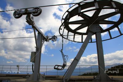 Nobody on ski lift above the ski slope
