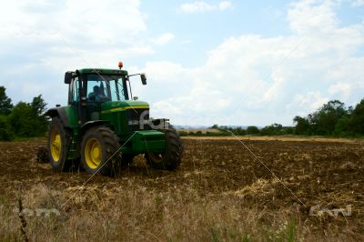 Tractor working on the field