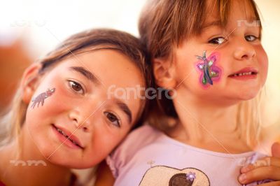 Cute Girls Showing Their Face Painting At A Party