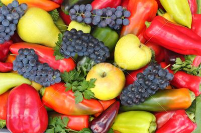 A lot of various fruits, red , yellow and green pepper.