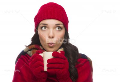 Mixed Race Woman Wearing Mittens Holds Mug Looks to Side