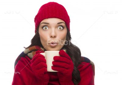 Wide Eyed Mixed Race Woman Wearing Winter Gloves Holds Mug Wide Eyed Mixed Race Woman Wearing Winter Gloves Holds Mug
