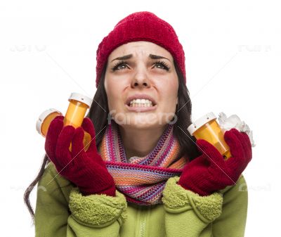 Sick Mixed Race Woman with Empty Medicine Bottles Blowing Nose 