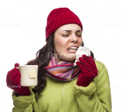 Sick Mixed Race Woman Drinks Hot Tea While Blowing Nose Sick Mixed Race Woman Drinks Hot Tea While Blowing Nose