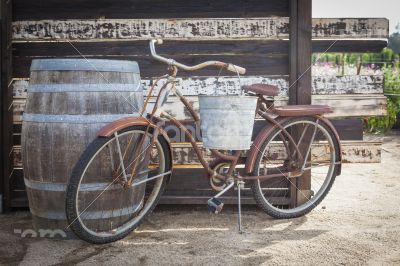 Old Rusty Antique Bicycle and Wine Barrel
