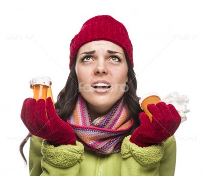 Sick Mixed Race Woman with Empty Medicine Bottles and Tissue 