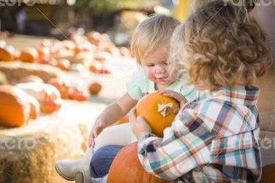 Young Family Enjoys a Day at the Pumpkin Patch