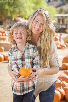 Attractive Mother and Son Portrait at the Pumpkin Patch