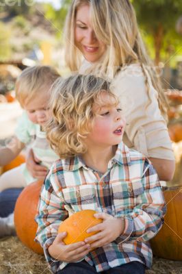 Young Family Enjoys a Day at the Pumpkin Patch Young Family Enjoys a Day at the Pumpkin Patch
