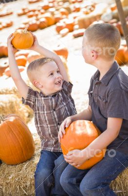 Two Boys at the Pumpkin Patch Talking and Having Fun