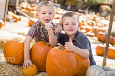 Two Boys at the Pumpkin Patch with Thumbs Up