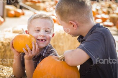 Two Boys at the Pumpkin Patch Talking and Having Fun