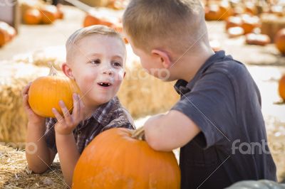 Two Boys at the Pumpkin Patch Talking and Having Fun