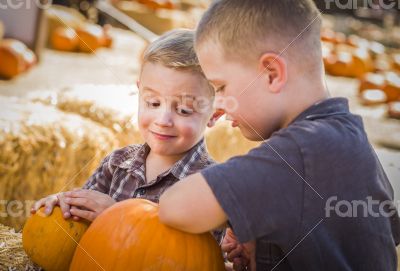 Two Boys at the Pumpkin Patch Talking and Having Fun