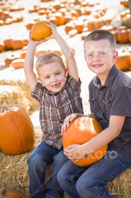 Two Boys at the Pumpkin Patch Talking and Having Fun