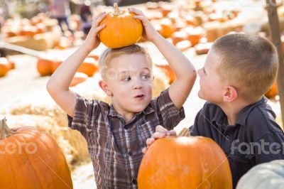 Two Boys at the Pumpkin Patch Talking and Having Fun