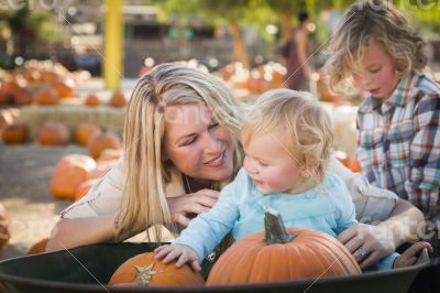 Young Family Enjoys a Day at the Pumpkin Patch Young Family Enjoys a Day at the Pumpkin Patch