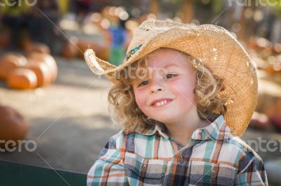 Little Boy in Cowboy Hat at Pumpkin Patch Little Boy in Cowboy Hat at Pumpkin Patch