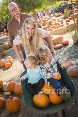Young Family Enjoys a Day at the Pumpkin Patch Young Family Enjoys a Day at the Pumpkin Patch