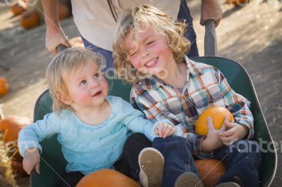 Young Family Enjoys a Day at the Pumpkin Patch