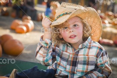 Little Boy in Cowboy Hat at Pumpkin Patch Little Boy in Cowboy Hat at Pumpkin Patch