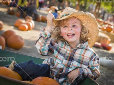 Little Boy in Cowboy Hat at Pumpkin Patch Little Boy in Cowboy Hat at Pumpkin Patch