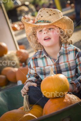 Little Boy in Cowboy Hat at Pumpkin Patch Little Boy in Cowboy Hat at Pumpkin Patch