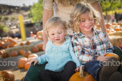 Young Family Enjoys a Day at the Pumpkin Patch