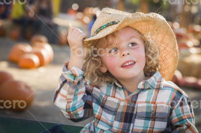 Little Boy in Cowboy Hat at Pumpkin Patch Little Boy in Cowboy Hat at Pumpkin Patch