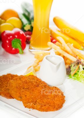classic Milanese veal cutlets and vegetables