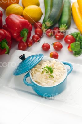 mac and cheese on a blue little clay pot