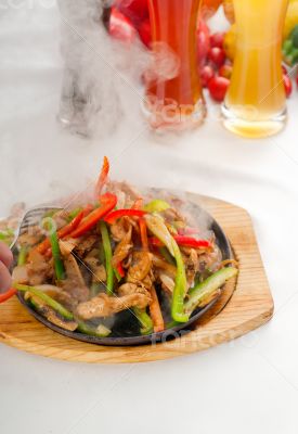 original fajita sizzling hot  on iron plate