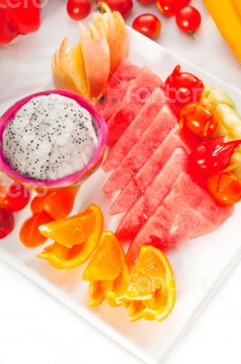 mixed plate of fresh sliced fruits