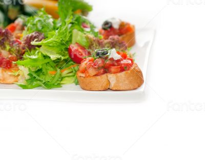 original Italian fresh bruschetta served with fresh salad and ve