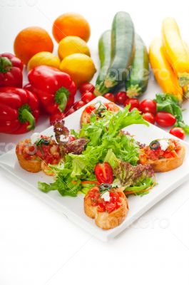 original Italian fresh bruschetta served with fresh salad and ve