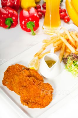 classic Milanese veal cutlets and vegetables