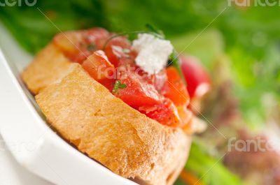 original Italian fresh bruschetta served with fresh salad and ve