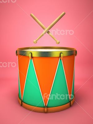 Drum and drumsticks on pink background