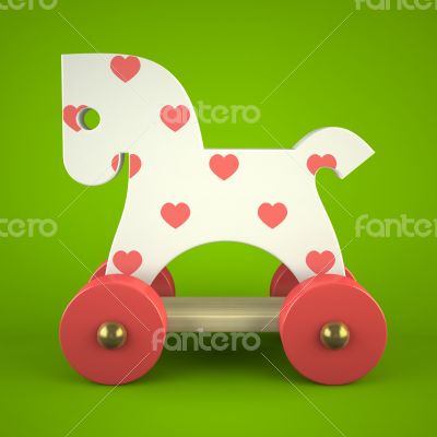 wood toy horse on green background